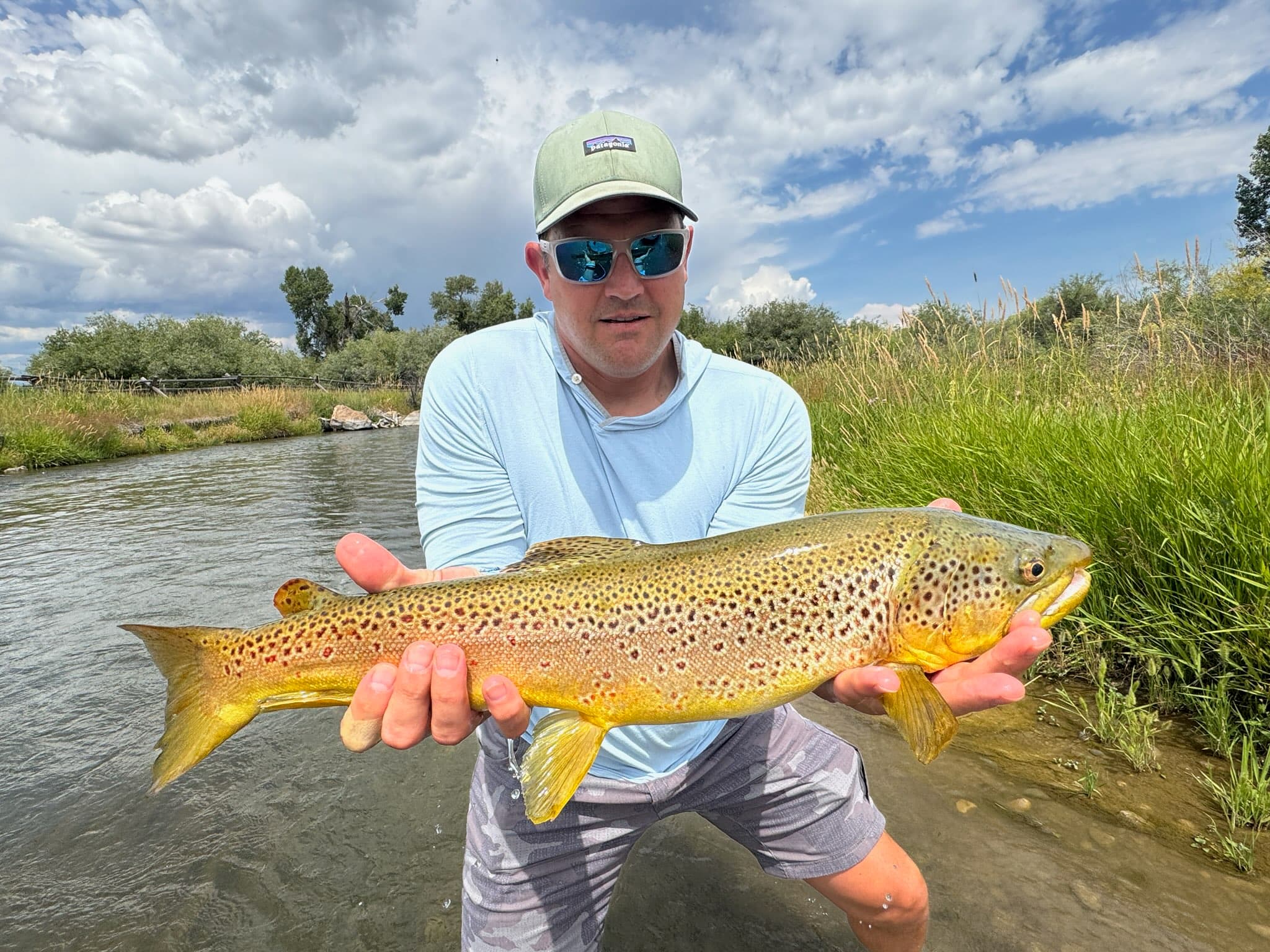 An angler with a Beaverhead River brown trout